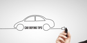 Man drawing a car with car buying tips written