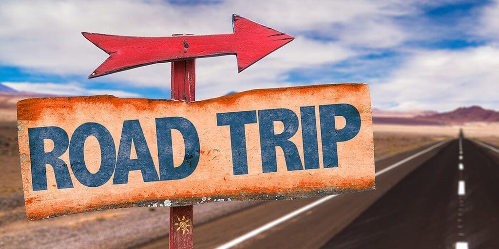 Arrow On Sign That Says Road Trip