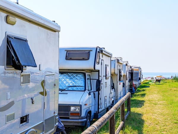 caravans parked along a beach side caravan park